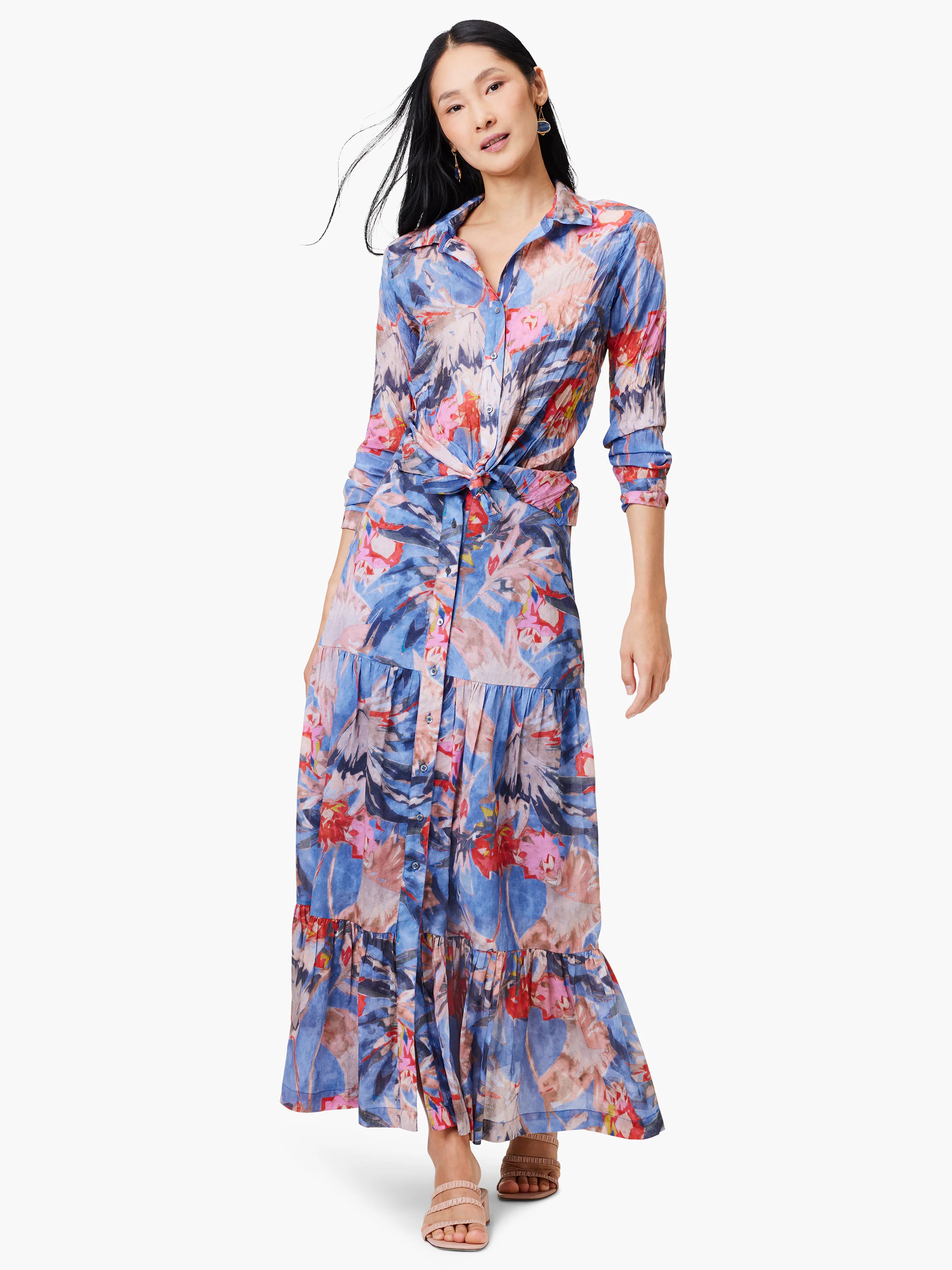 Blue tiered maxi skirt with red, pink, and muted orange floral print. Button front.