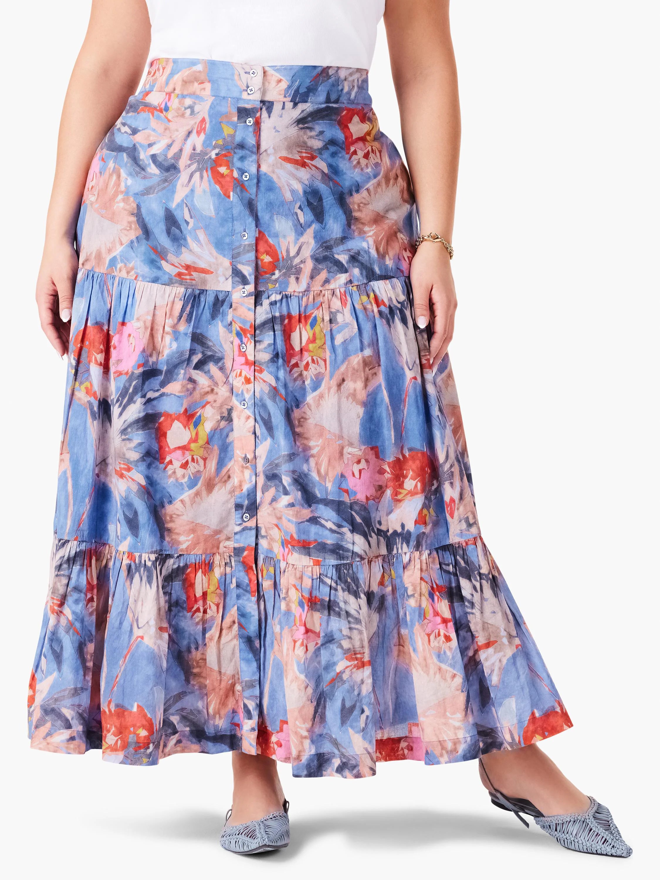 Tiered maxi skirt in blue, with red, pink & orange abstract floral print. Button front.