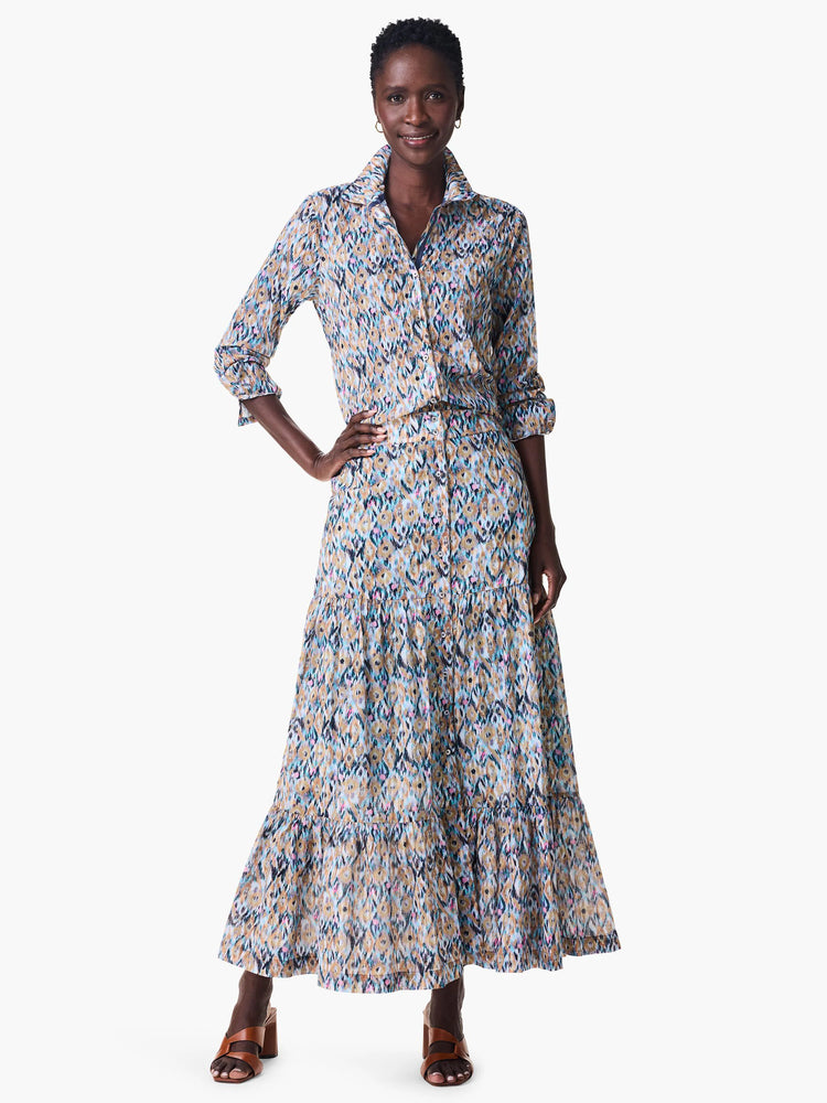 Maxi skirt in blue, tan, & pink ikat print. Tiered, with a button front.