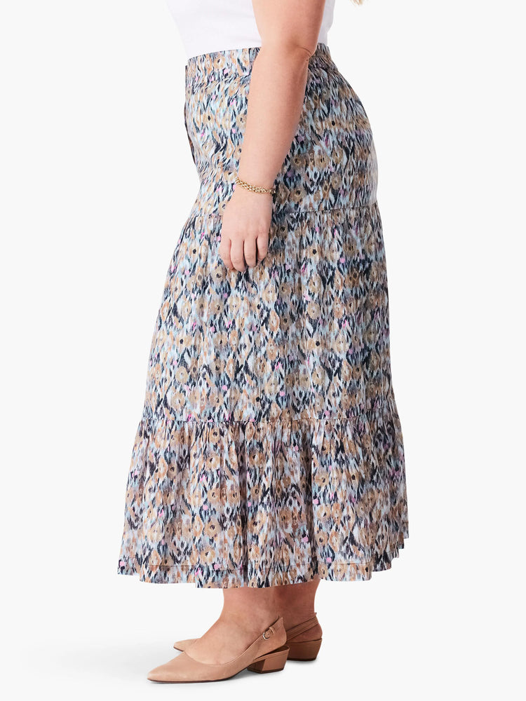 Here's alt text for the image, under 125 characters:
Tiered maxi skirt in blue, brown, and tan ikat pattern. Multiple...
