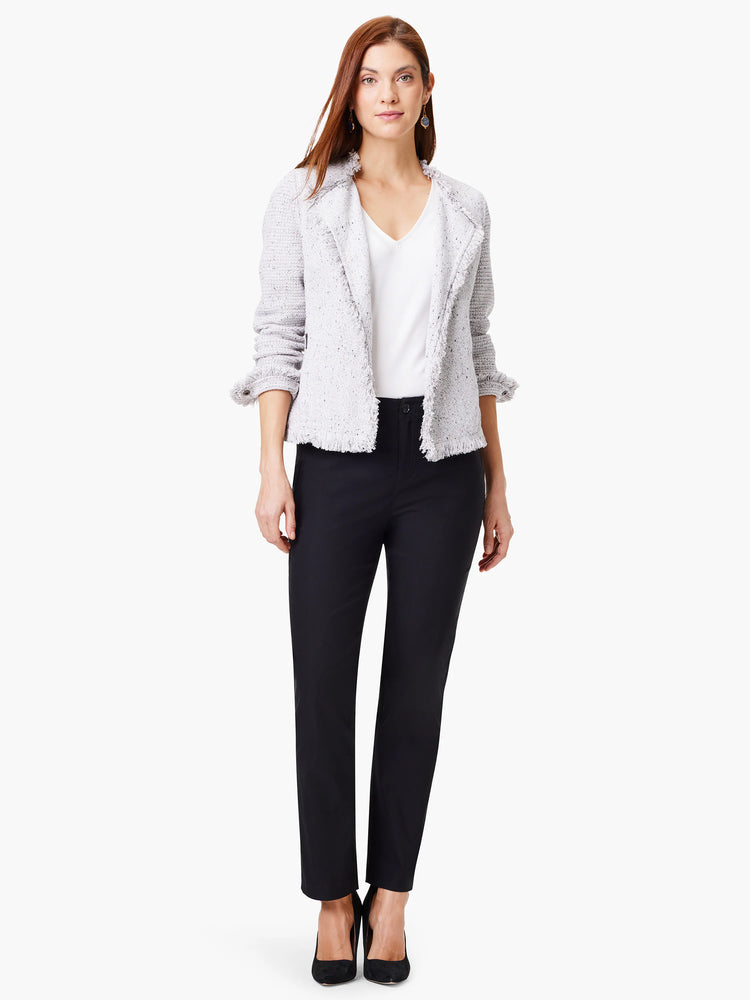 Black straight-leg pants on a model. The pants are shown with a light gray tweed jacket.