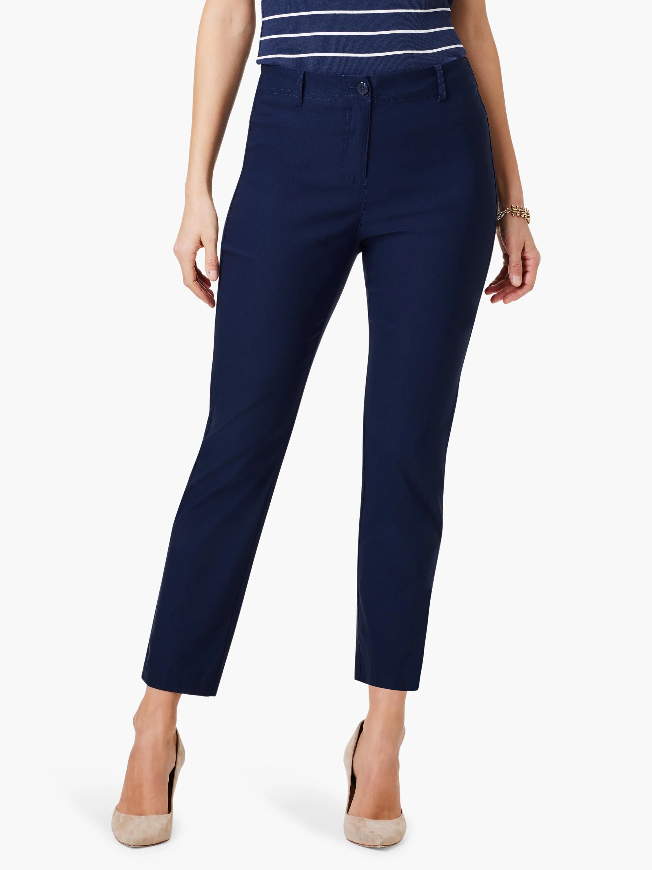 Navy blue straight-leg pants; cropped at ankles. Model wears nude heels.