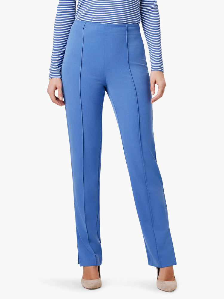 Straight, mid-blue pants with side slits. The pants are shown on a model.