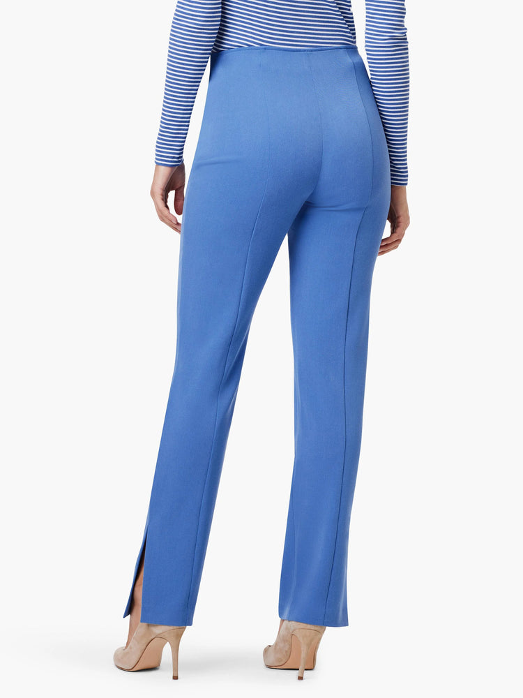 Blue straight-leg pants with side slits. Rear view.