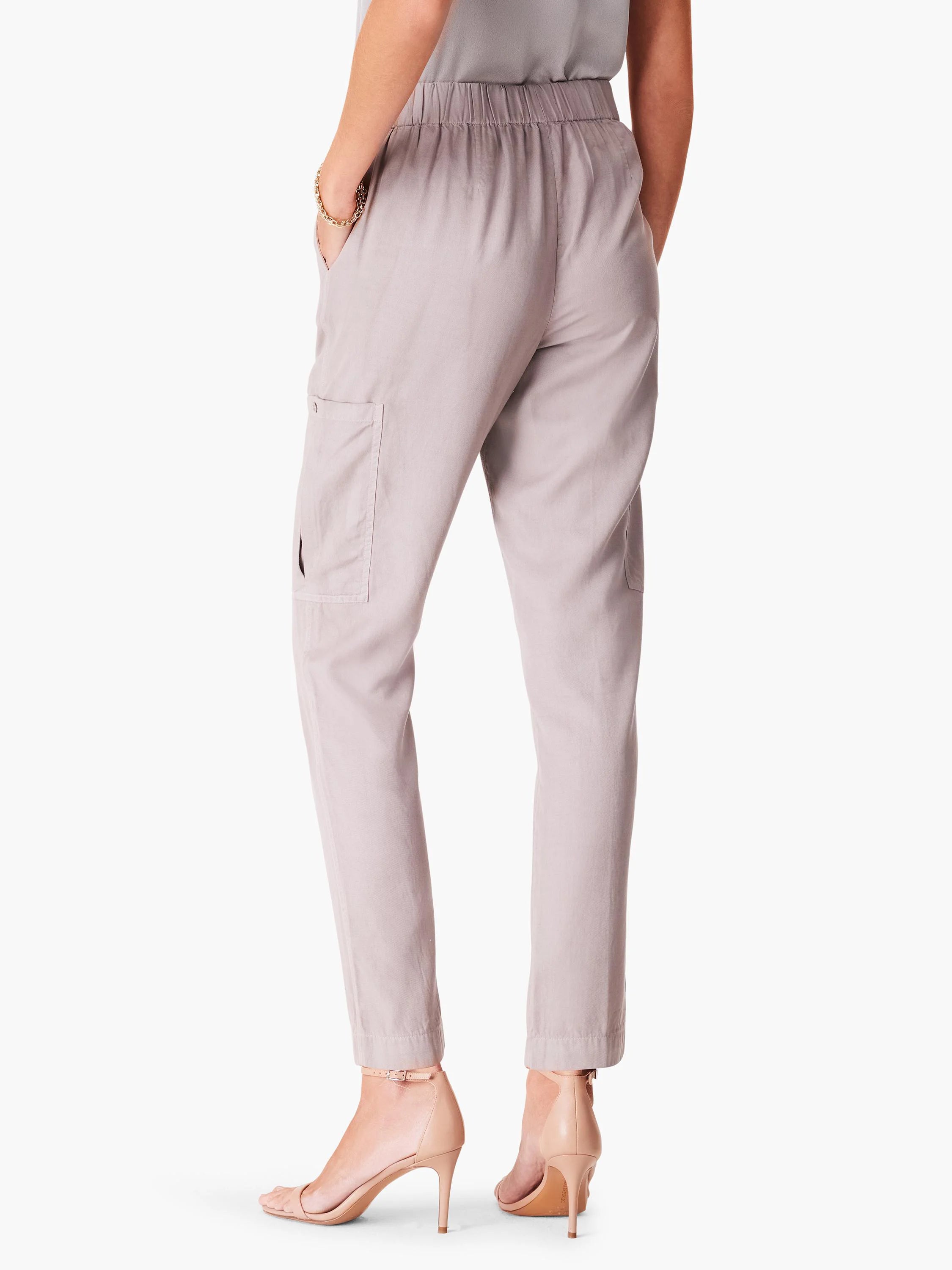 Light gray cargo pants with a relaxed fit, elastic waistband, and side pockets. The pants are ankle-length.