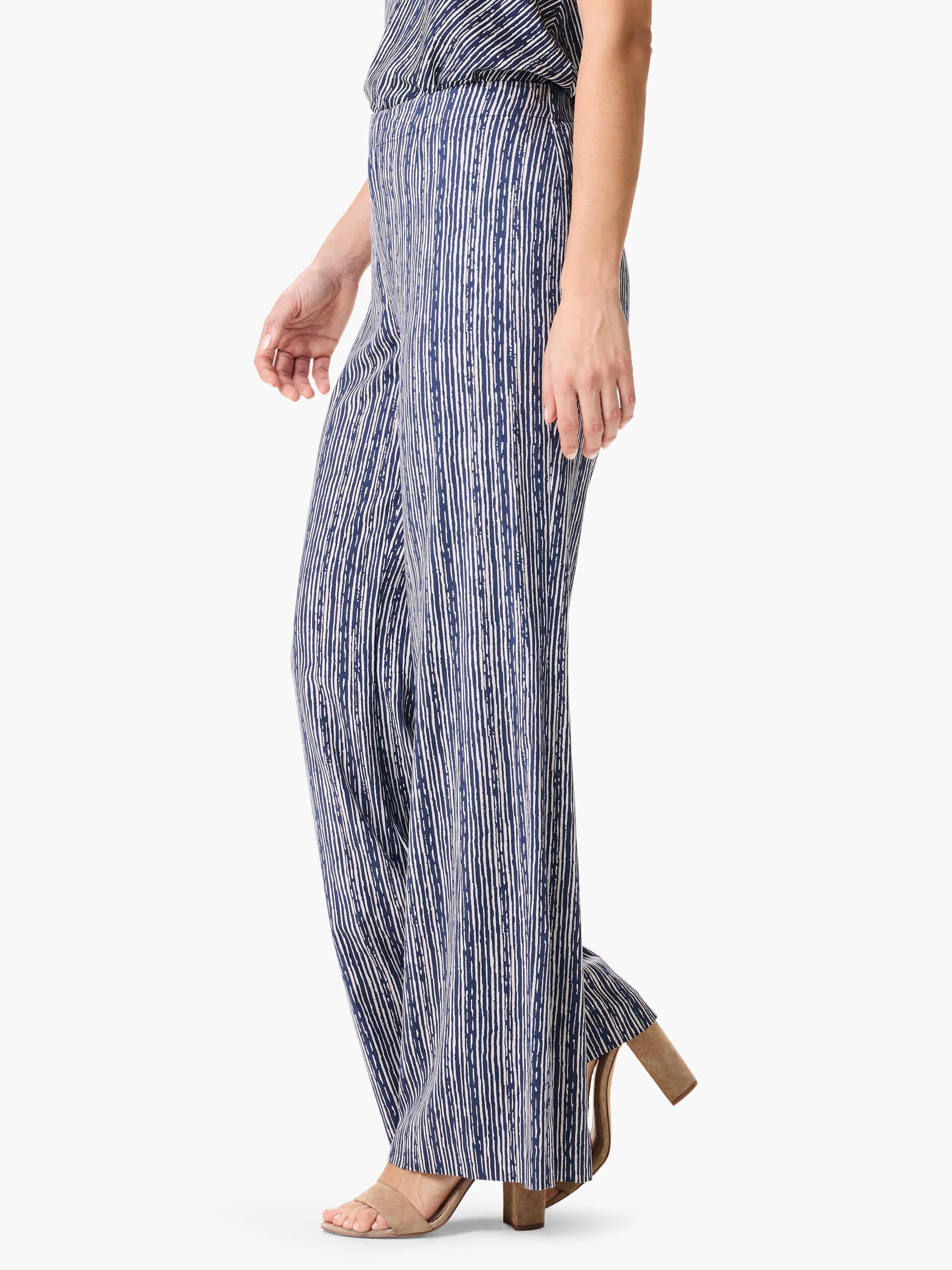 Wide-leg pants, navy blue with off-white vertical stripes. A textured, slightly irregular stripe pattern.