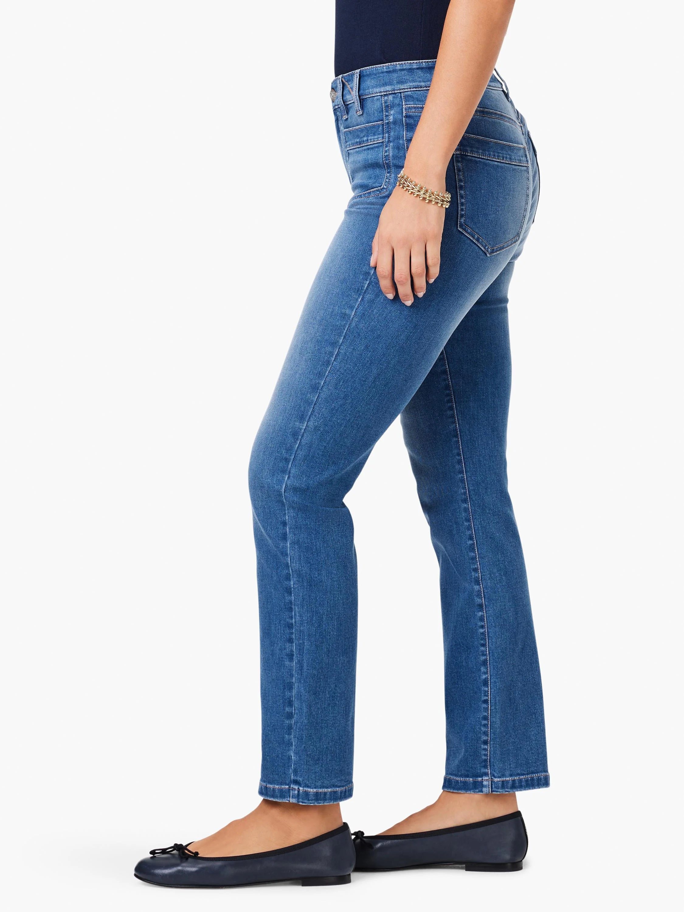 Medium blue mid-rise straight leg jeans with front and back pockets, visible light contrast stitching.