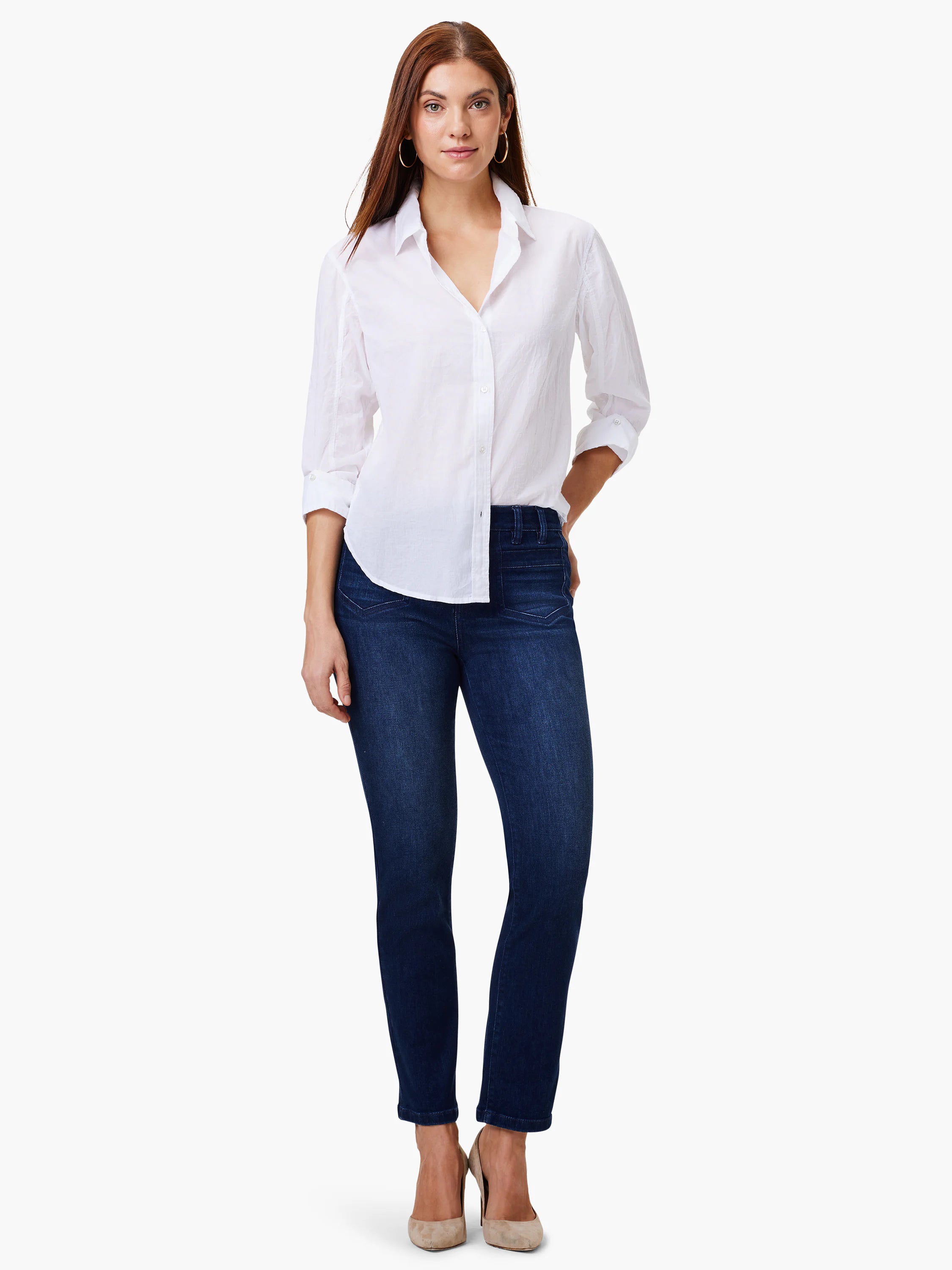 Dark wash blue mid-rise straight jeans with prominent front patch pockets, worn by a model.