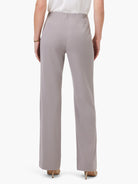 Taupe wide-leg trousers, back view on model. Elasticated, gathered waistband at the back.