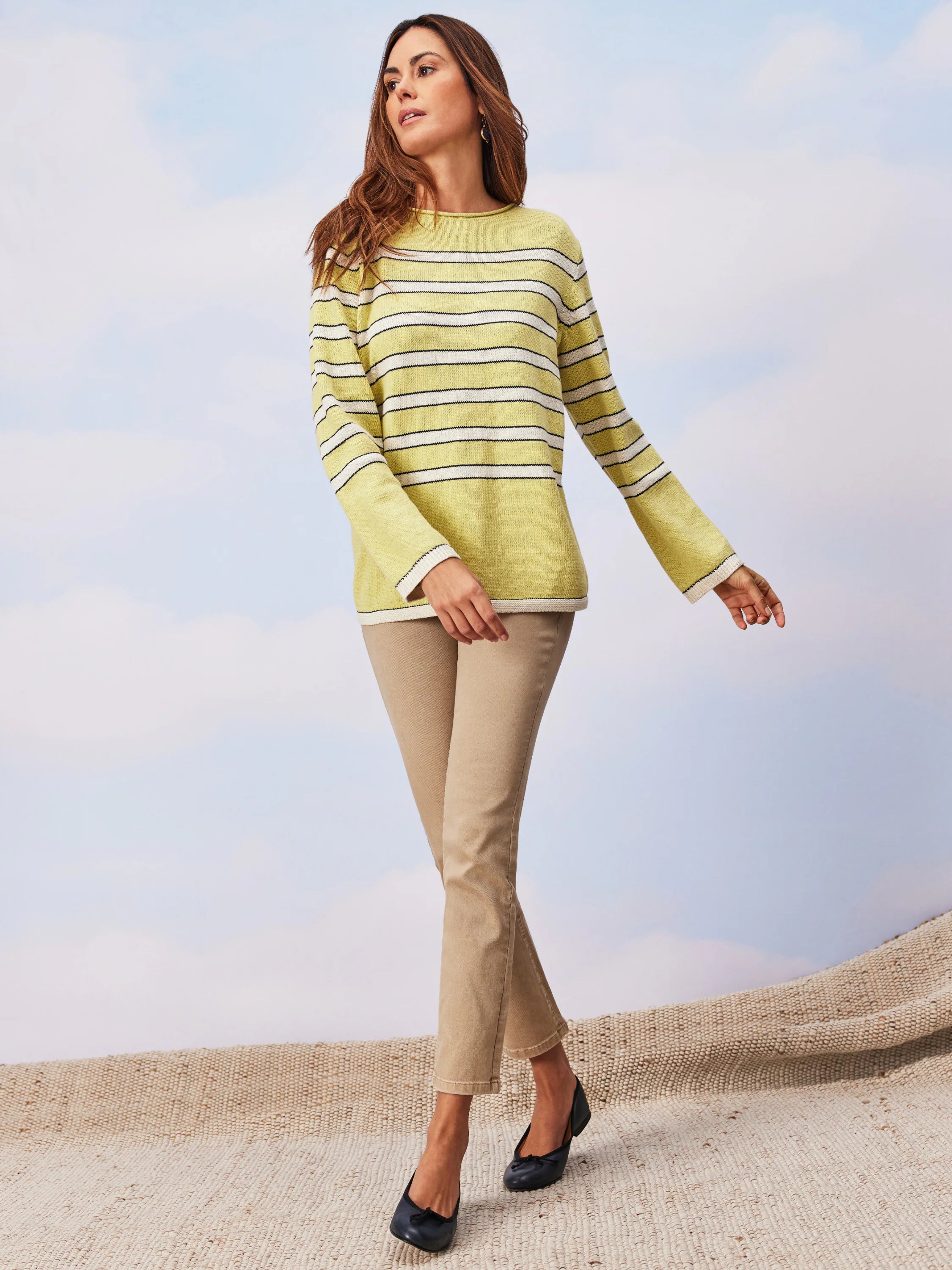 Khaki mid-rise straight pocket jeans on a model.