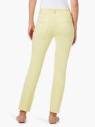 Pale yellow mid-rise straight jeans, back view, with two patch pockets and belt loops.
