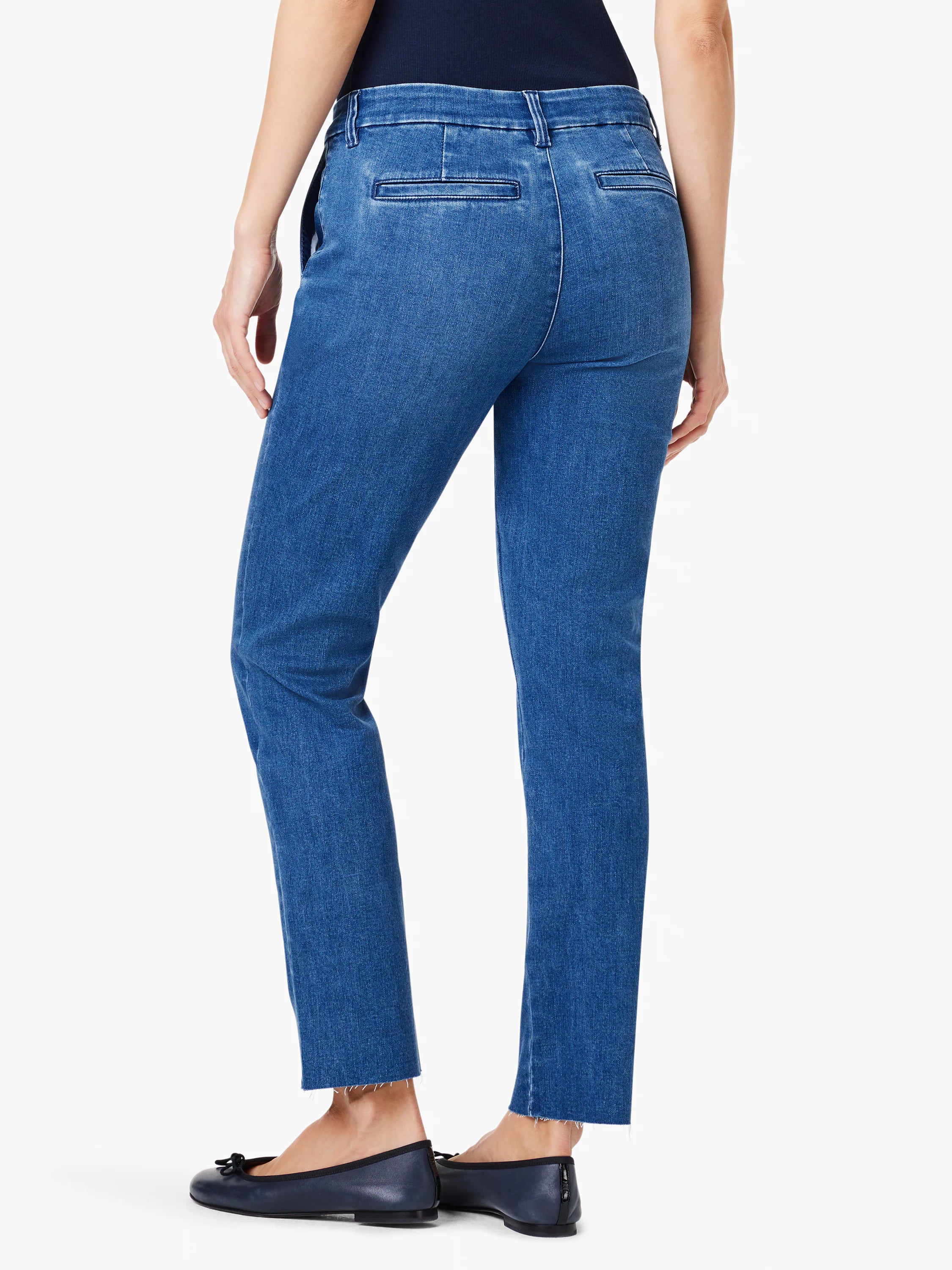 Medium blue denim straight ankle trousers with frayed hems and flat back pockets, worn by a model from behind.