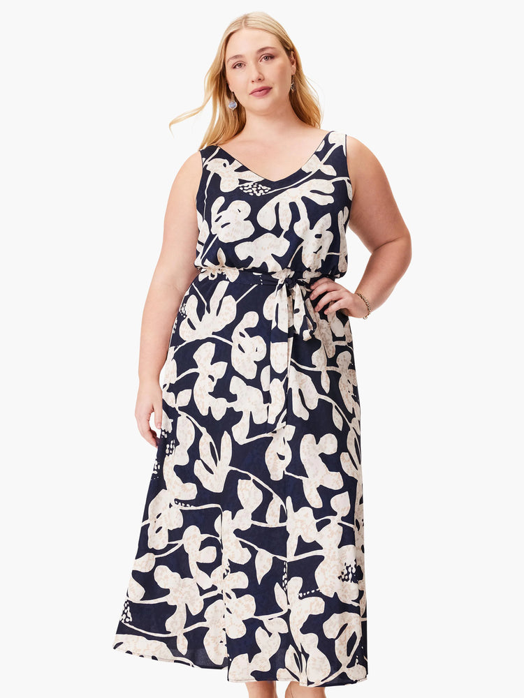 Navy midi dress with off-white stylized floral print. Sleeveless, V-neck, belted waist.
