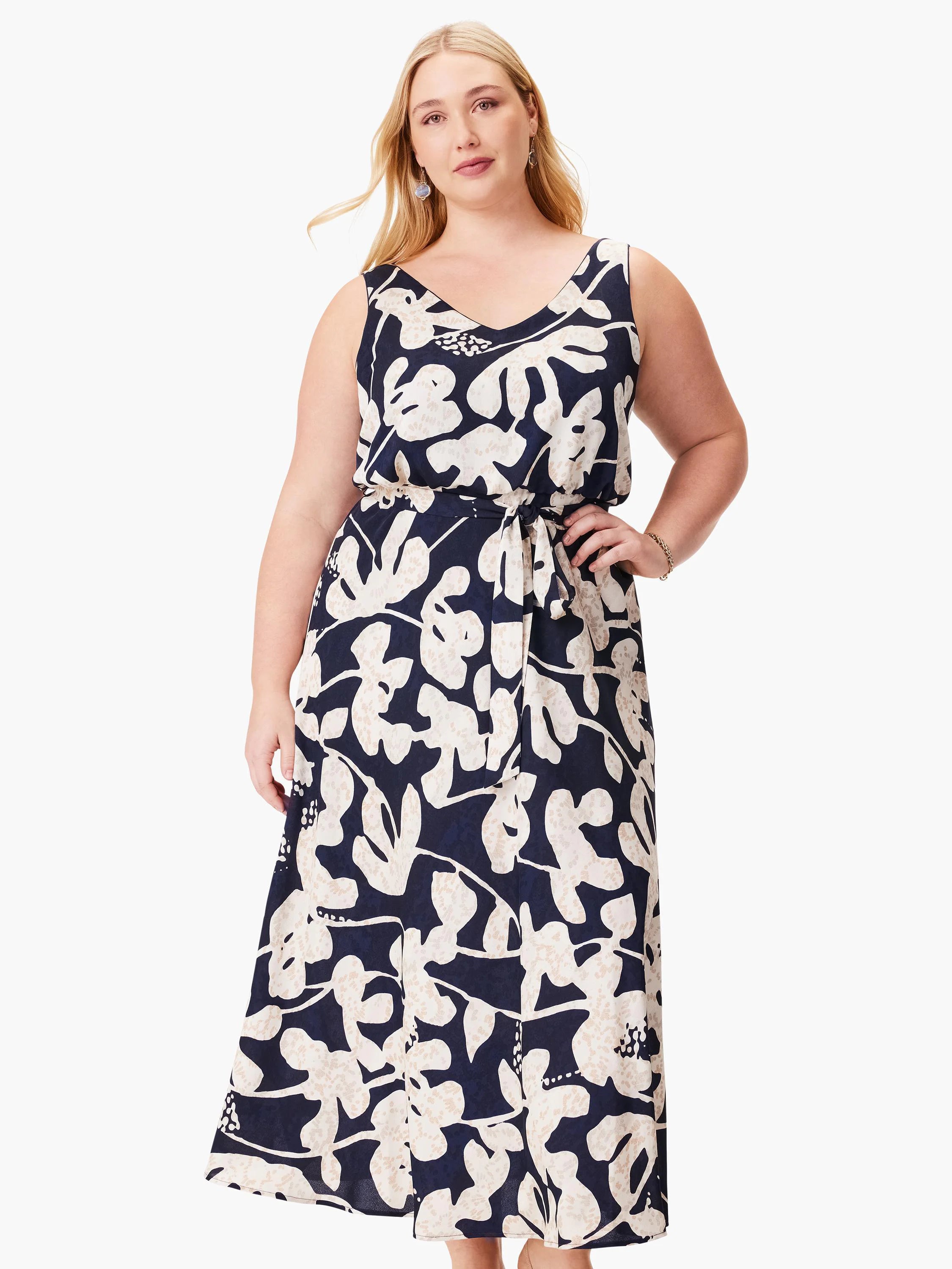 Navy midi dress with off-white stylized floral print. Sleeveless, V-neck, belted waist.