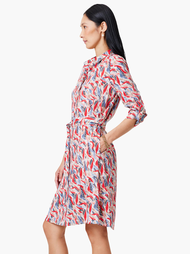 Red, blue, and beige patterned shirt dress with 3/4 sleeves and a belted waist.