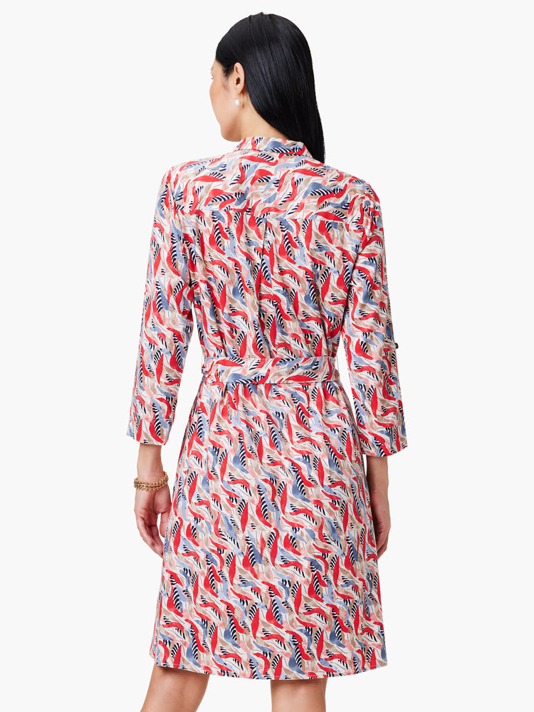 Red, blue, and beige patterned shirt dress with a belted waist and three-quarter sleeves.