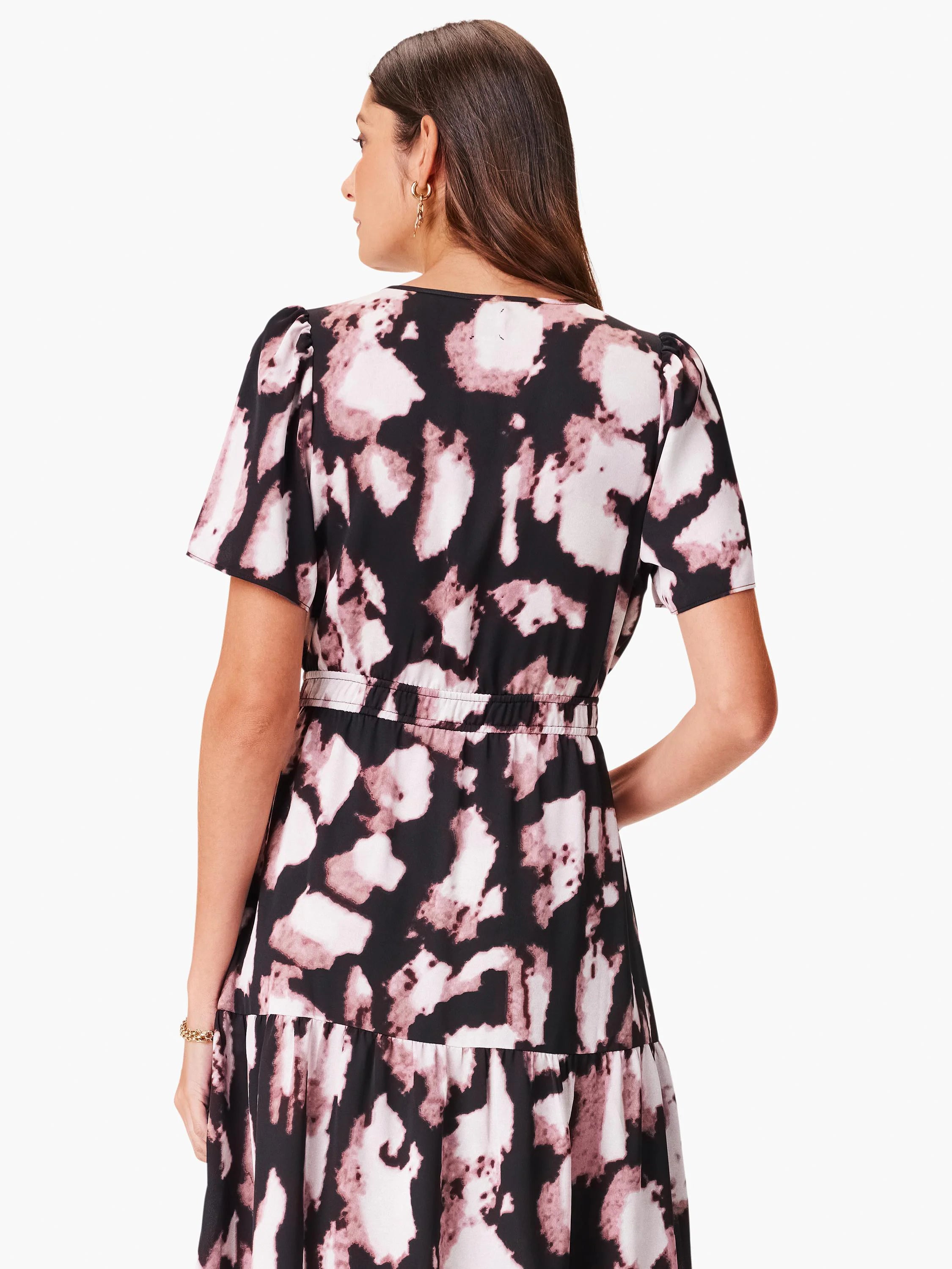 Black and mauve tie-dye print midi dress. Short sleeves, fitted bodice, tiered skirt, and elastic waist. Back view.