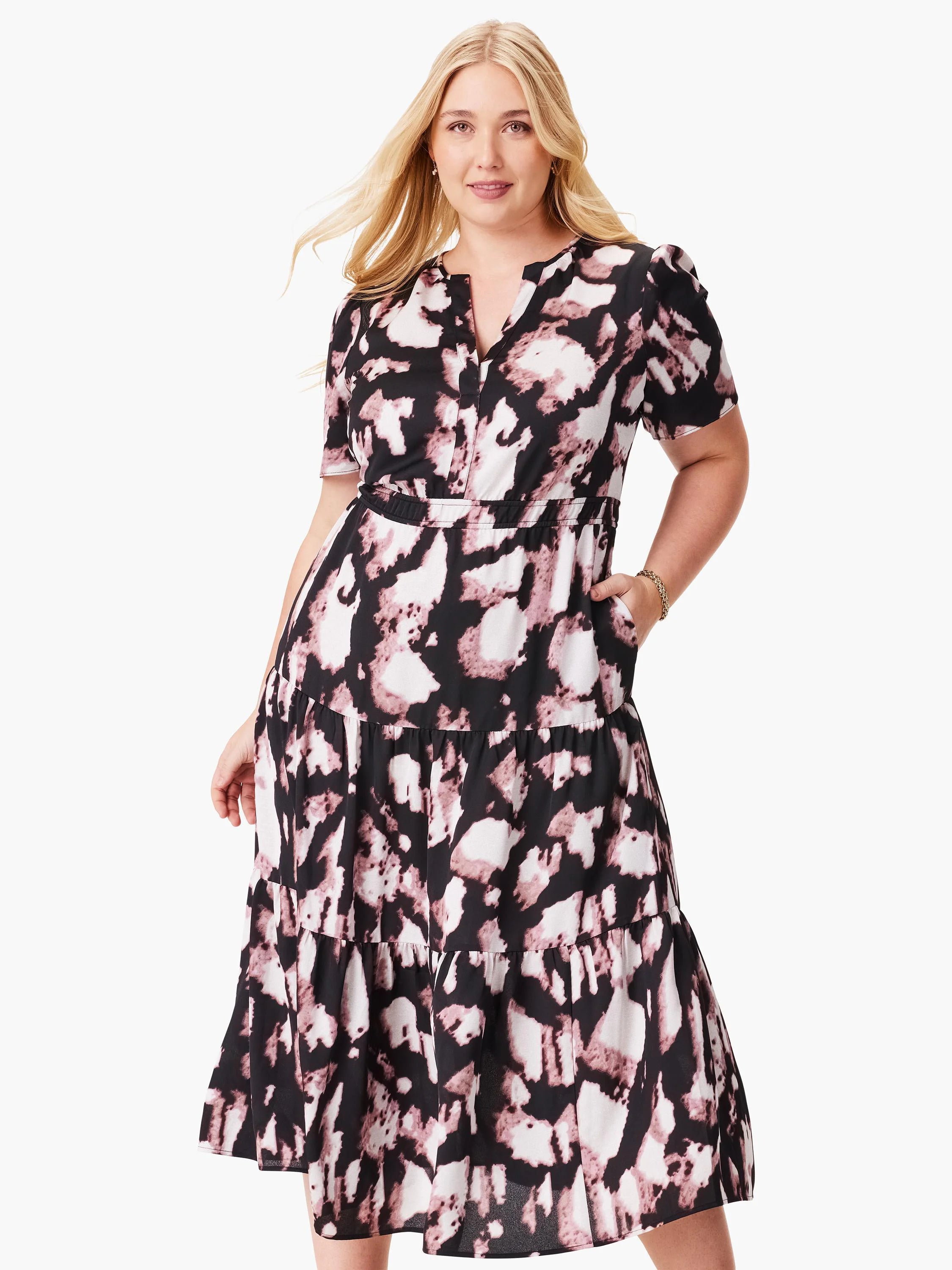 Black midi dress with mauve and white abstract print. Short sleeves, V-neck, tiered skirt, and pockets.