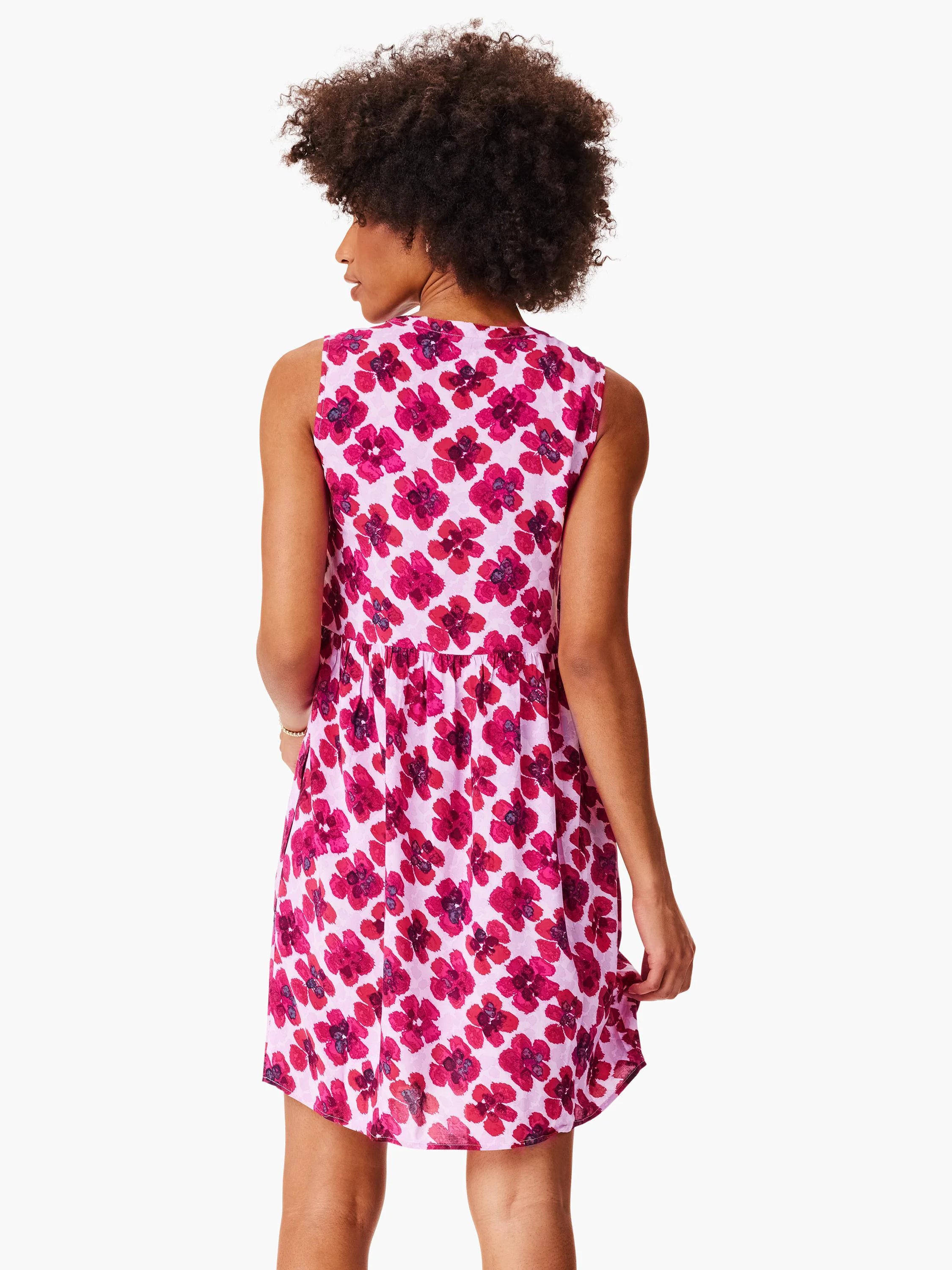 Pink sleeveless mini dress with a red floral print. The back shows a gathered waist.