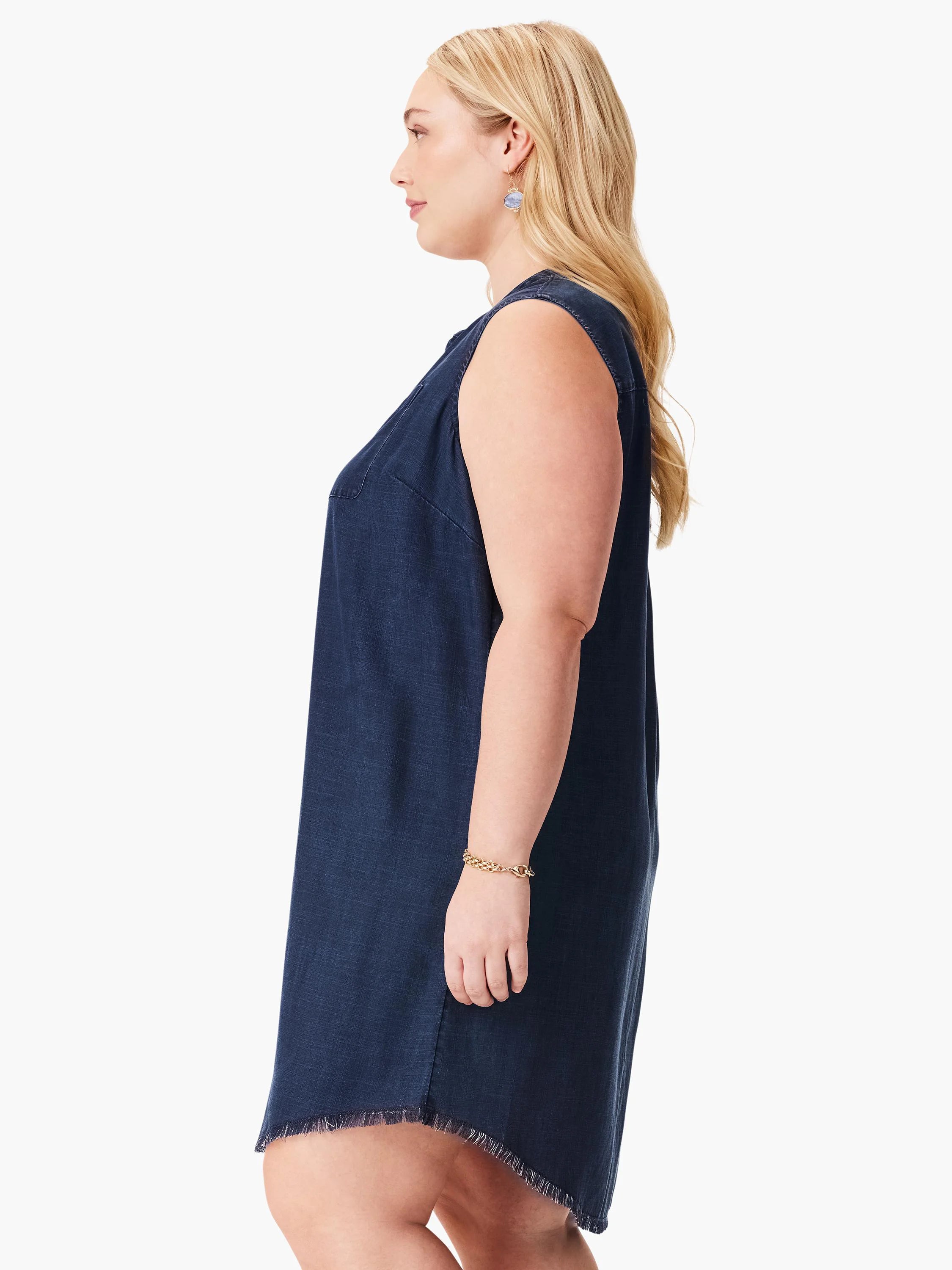 Dark blue sleeveless denim dress with a loose fit, frayed hem, and chest pocket. It is above-knee length.