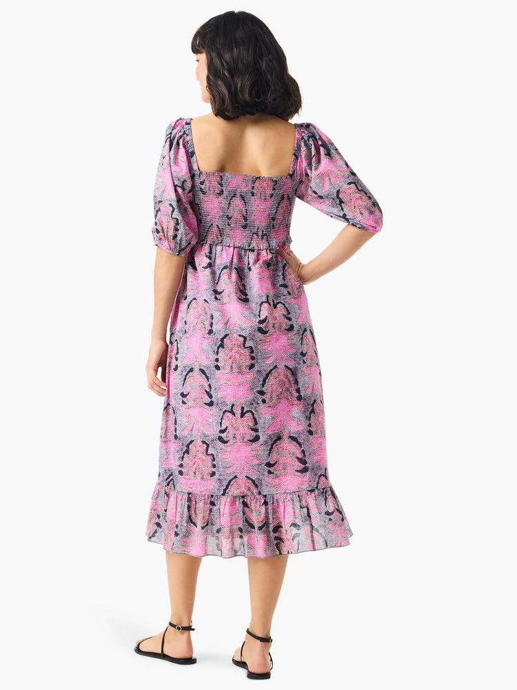 Pink and gray floral midi dress with puff sleeves, square neckline, and smocked bodice. Features a ruffled hem.