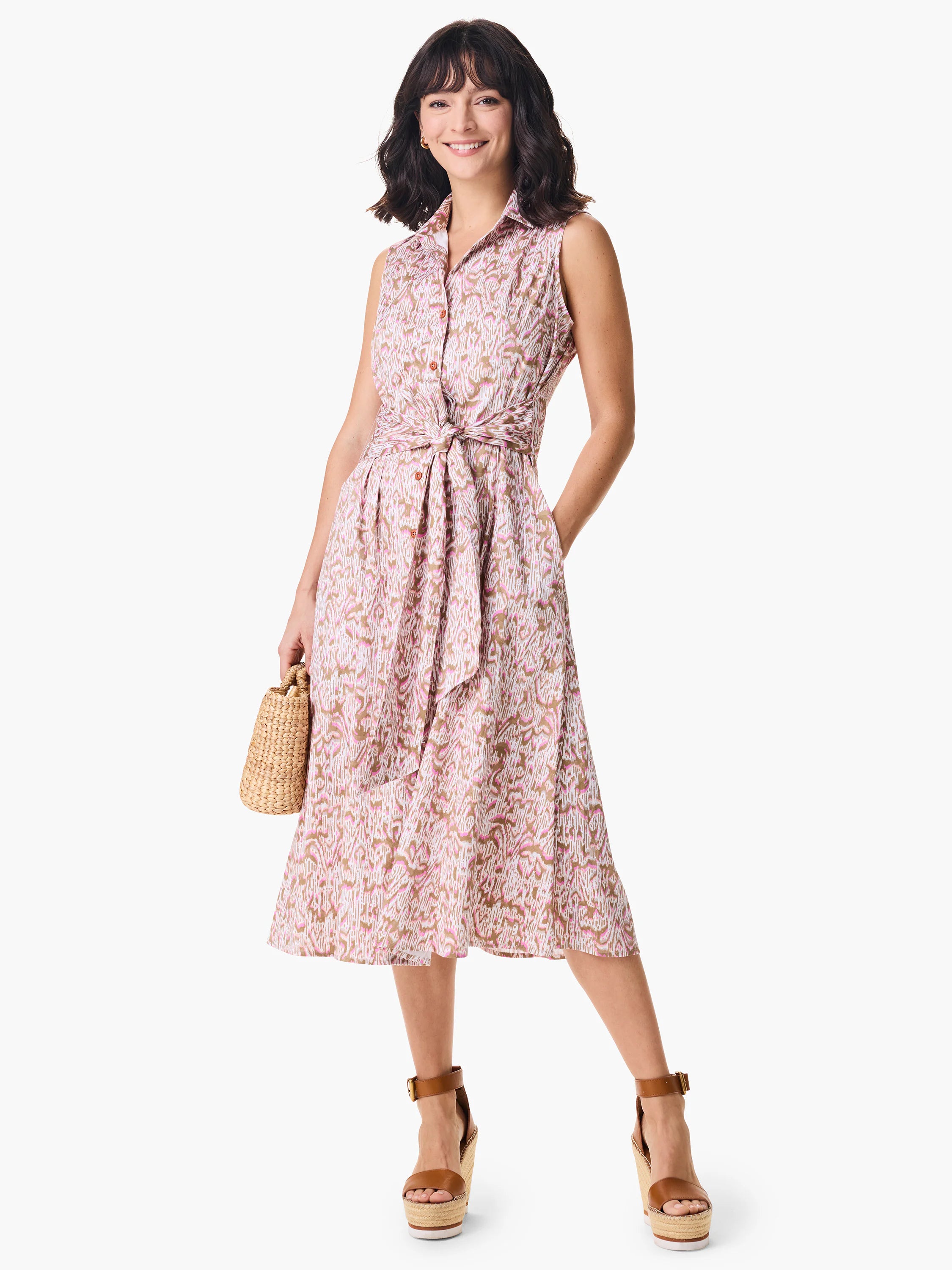 Sleeveless midi shirt dress with a belted waist. Pink, brown, and white abstract animal print.