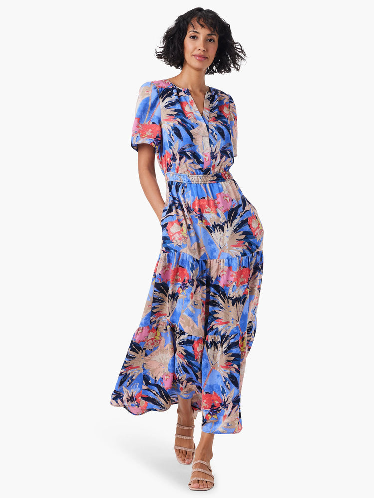 Maxi dress, blue background, red, pink & beige floral print. Short sleeves, tiered skirt.