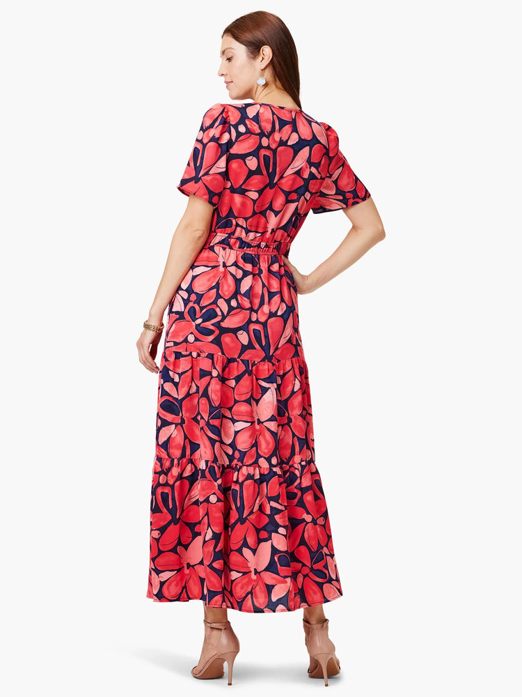 Red and navy floral maxi dress with short sleeves and tiered skirt. Elastic waistband.
