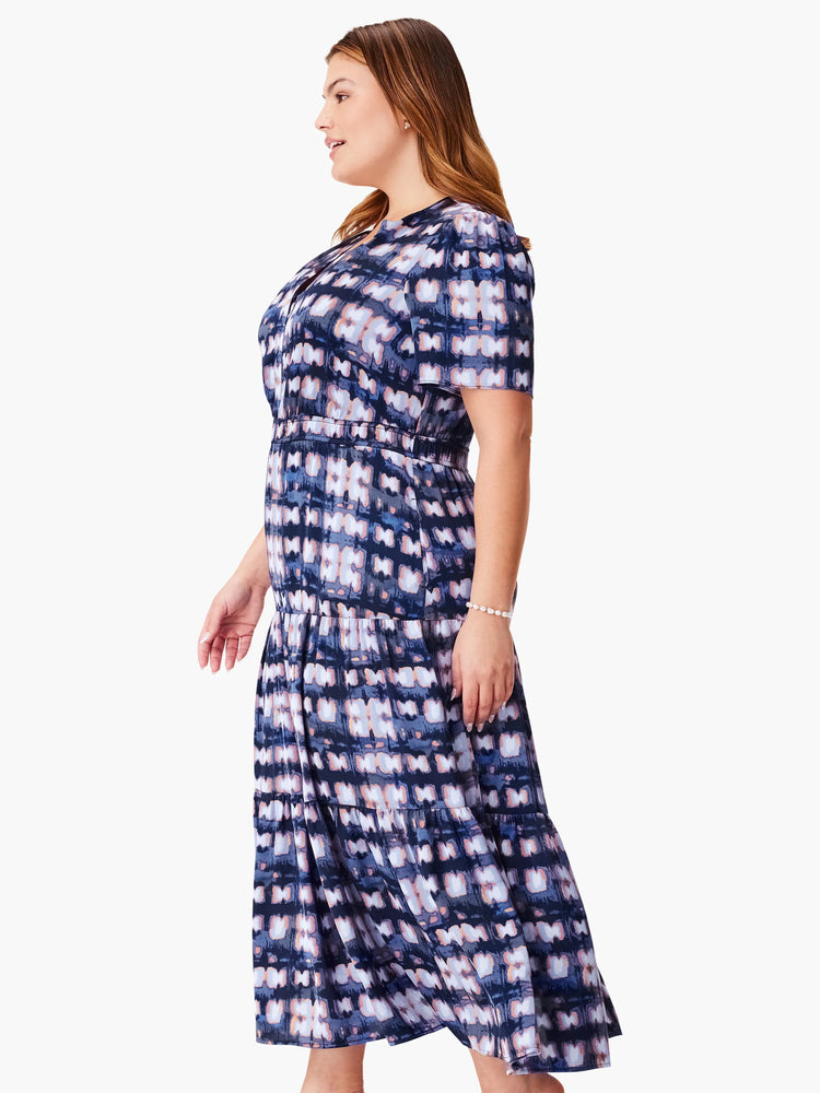 Midi dress, tiered skirt, short sleeves. Navy, blush pink, and grey abstract print.