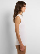White sleeveless tank, featuring a crisp, structured collar.