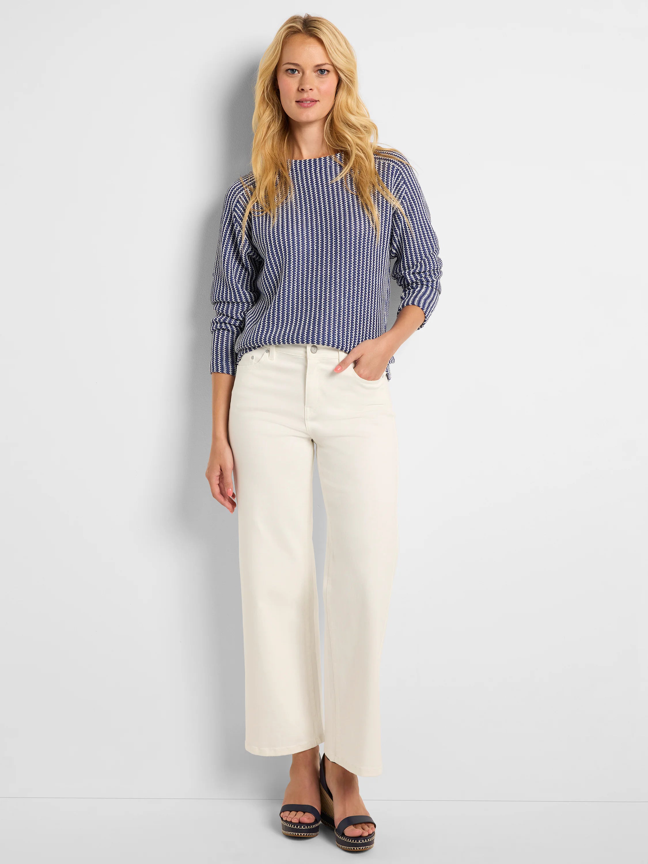 Navy blue and white knit top with a distinct vertical zig-zag pattern.