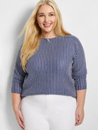 Navy and white zig-zag knit top with 3/4 sleeves, boat neck.