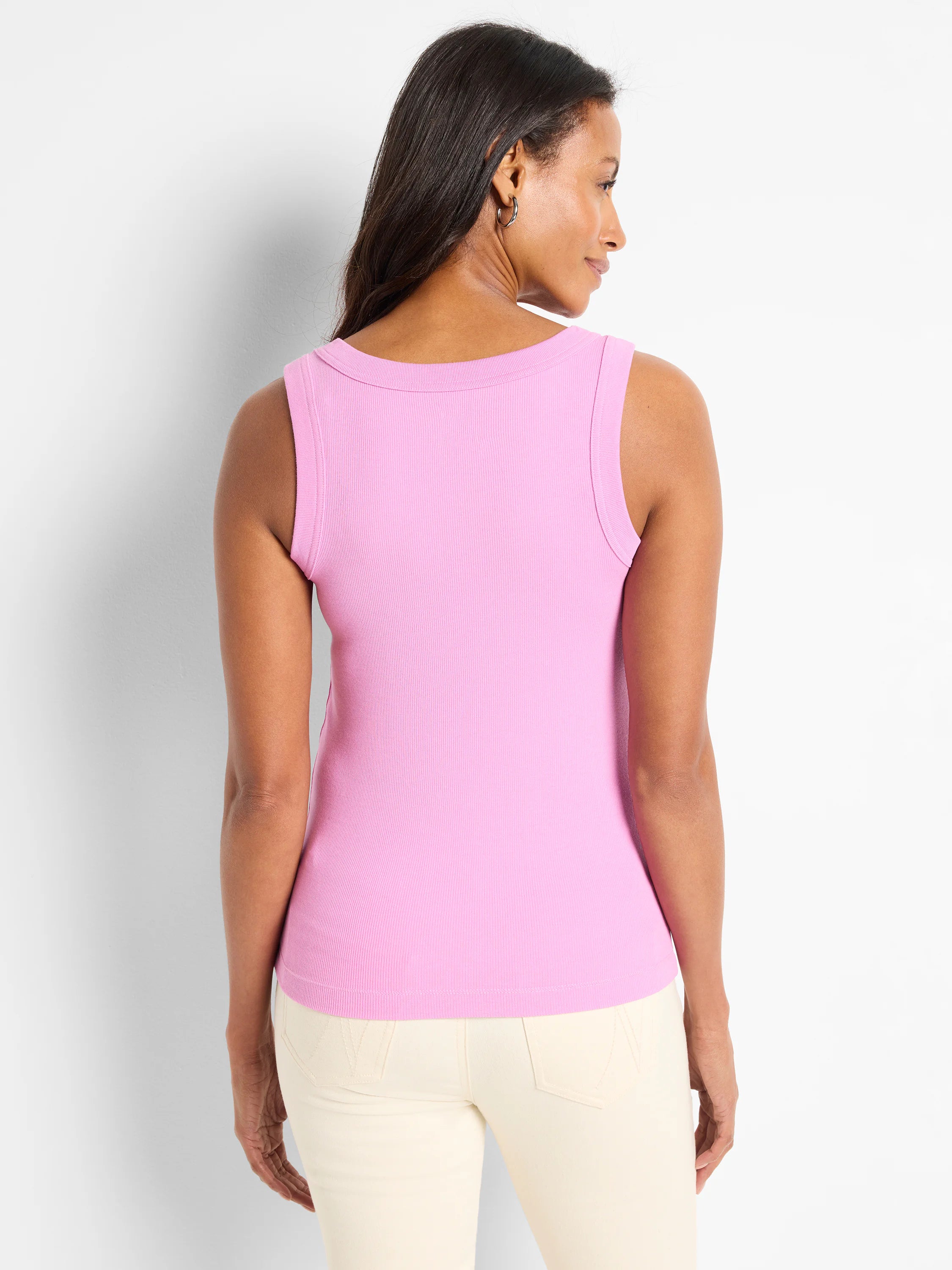 Pink ribbed knit scoop tank top on model, back view. Features a wide scoop neckline and fitted silhouette.