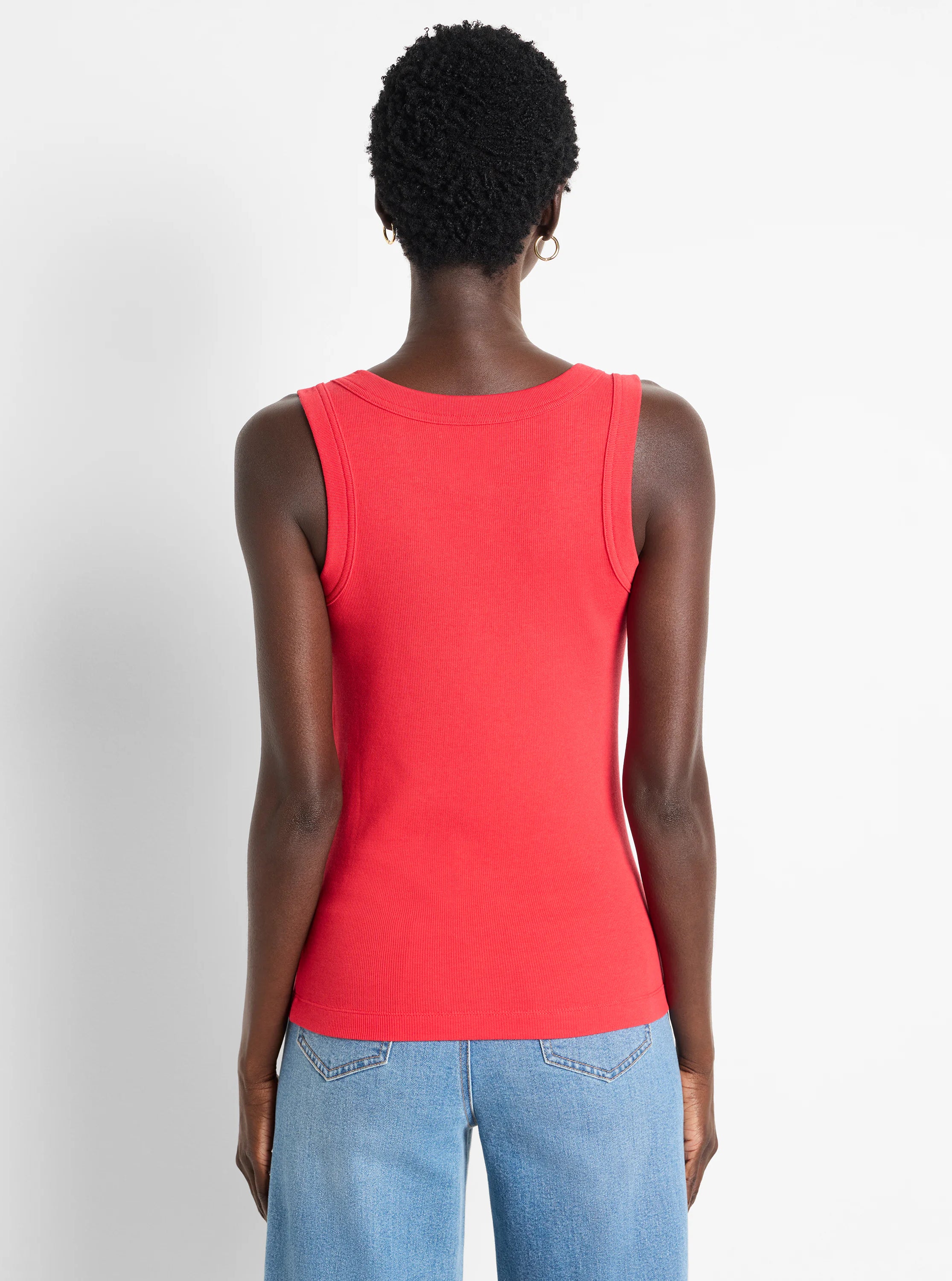 Red ribbed knit scoop tank, shown from the back on a model.