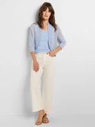 Light blue, ribbed knit, scoop neck tank top worn by a model.