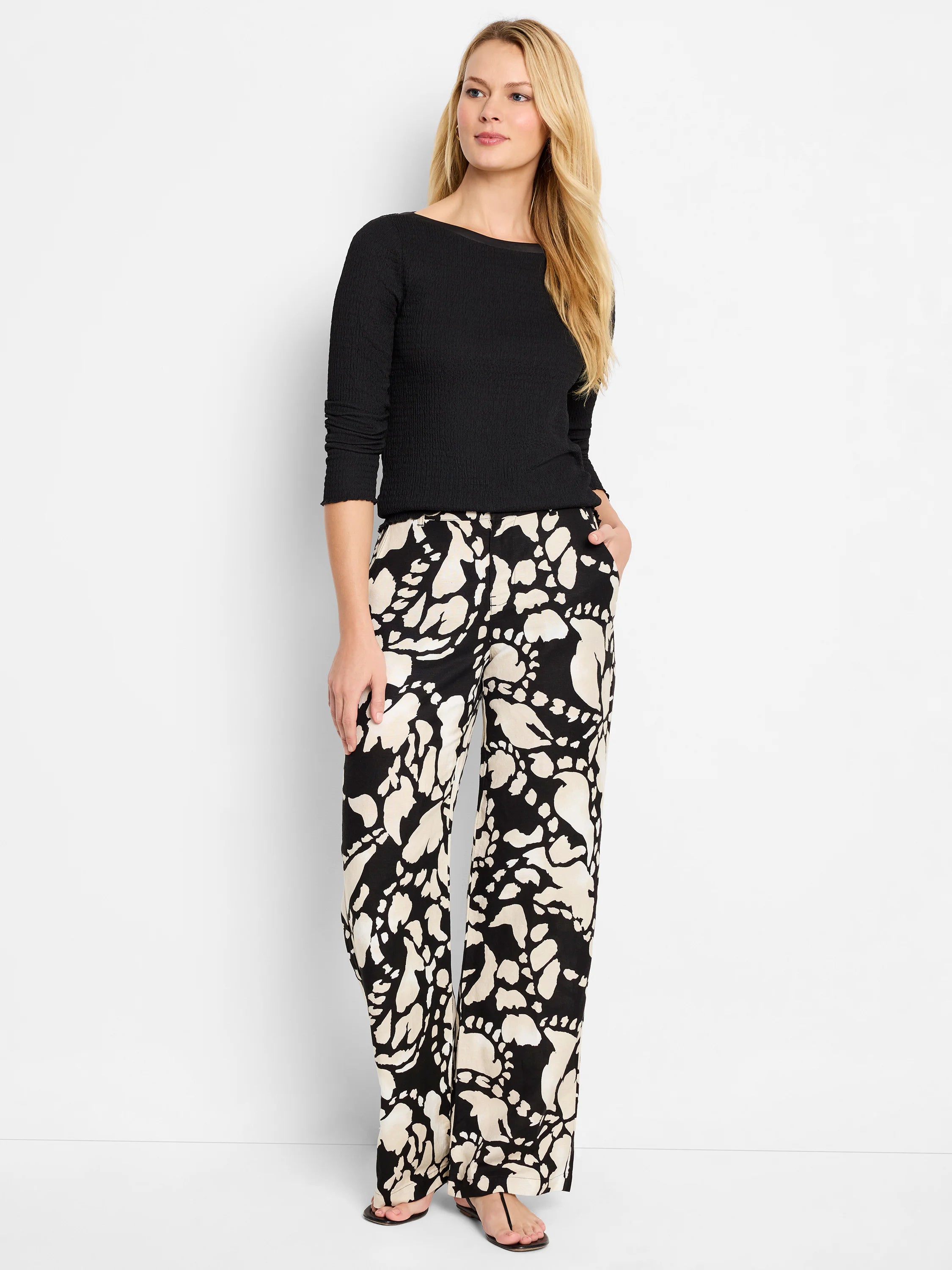 Black Bubble Knit Top with boat neck, 3/4 sleeves, and a textured surface, worn by a model.