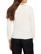 Cream, long-sleeved top with a crinkled texture. Features a boat neck, wavy hem, and cuffs. Model's back view.