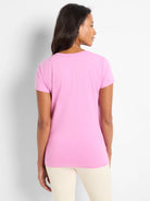 Pink crew neck t-shirt with short sleeves and smooth texture.