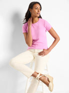 Bright pink, smooth knit crew neck t-shirt with short sleeves.