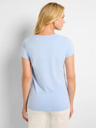 Light blue crew neck t-shirt with short sleeves, a smooth knit, and relaxed fit.