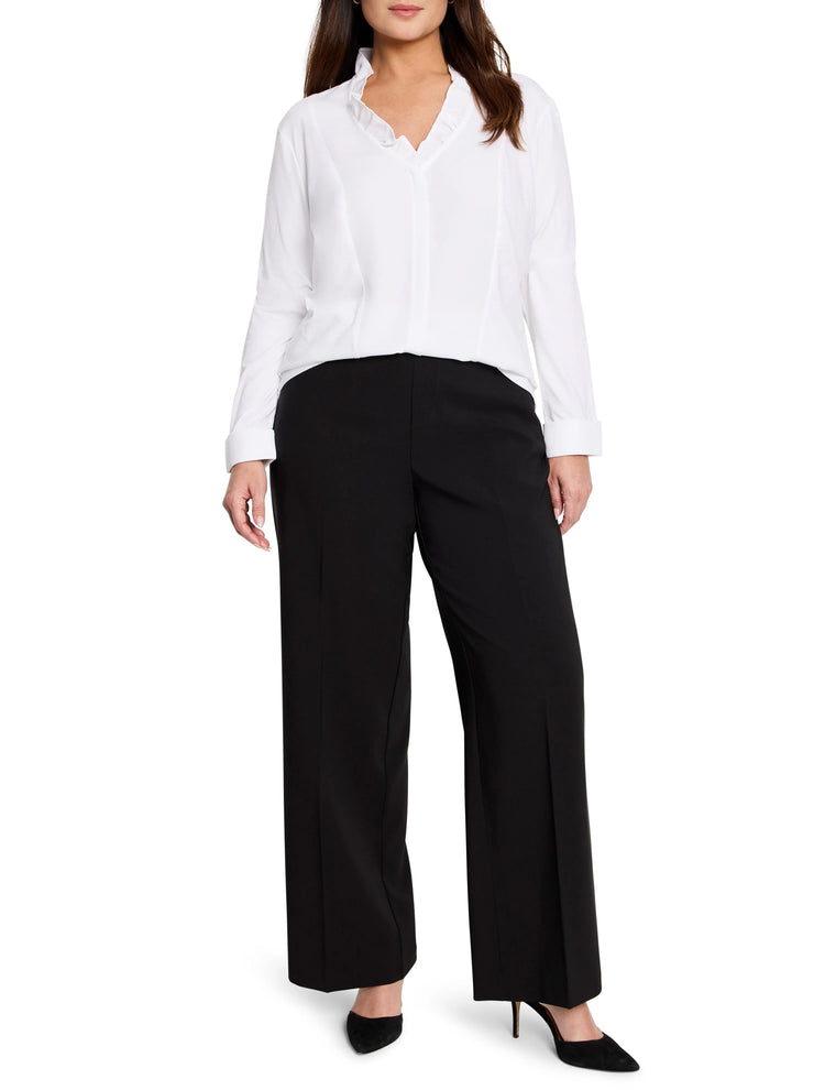 White shirt with a ruffled V-neckline and long sleeves.