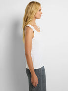 White knit tank top with a scoop neckline and wide shoulder straps.