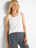 White knit tank top with a scoop neck and smooth fabric texture.