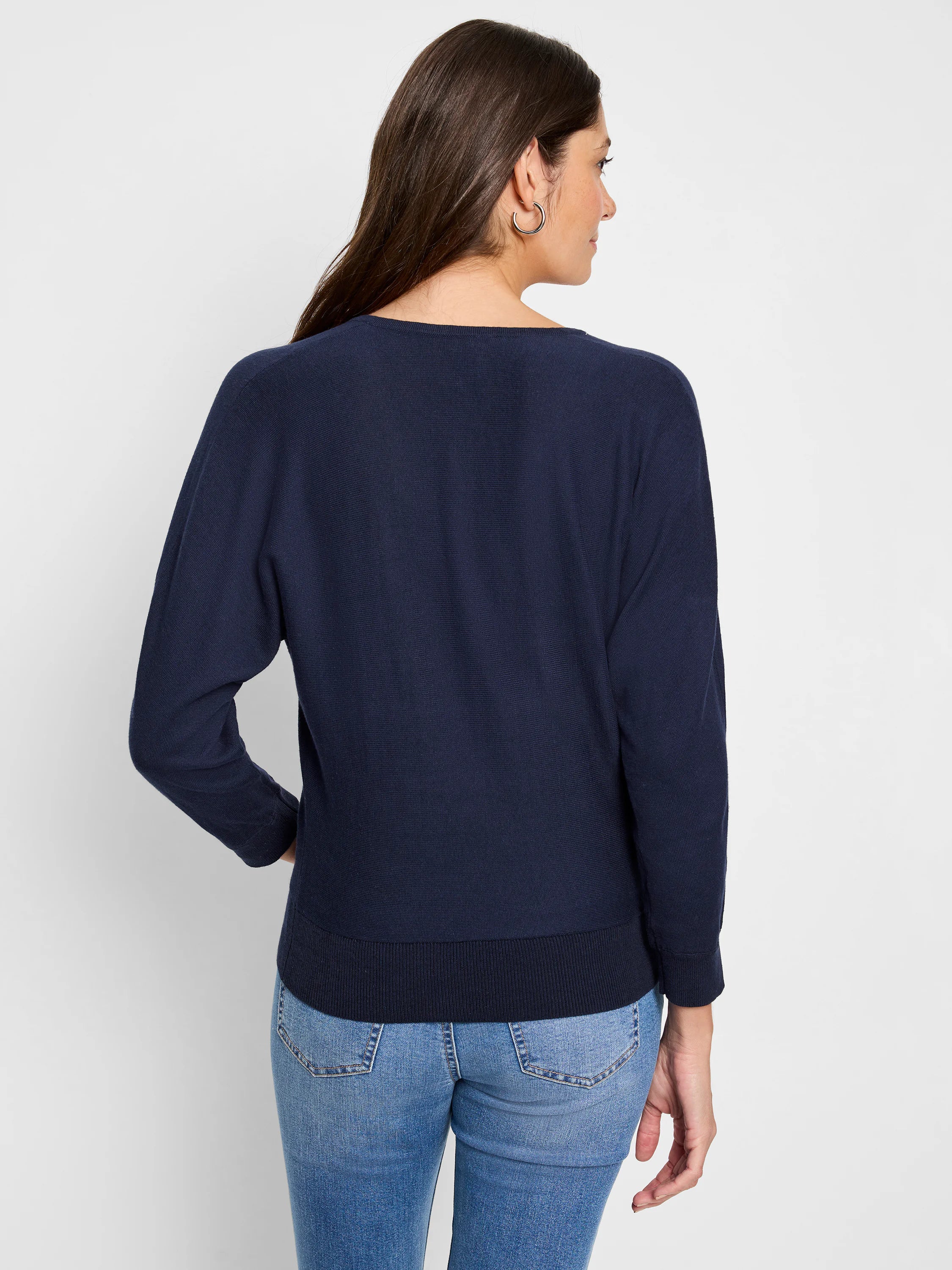 Dark blue long-sleeve knit sweater, back view, with ribbed hem and cuffs.