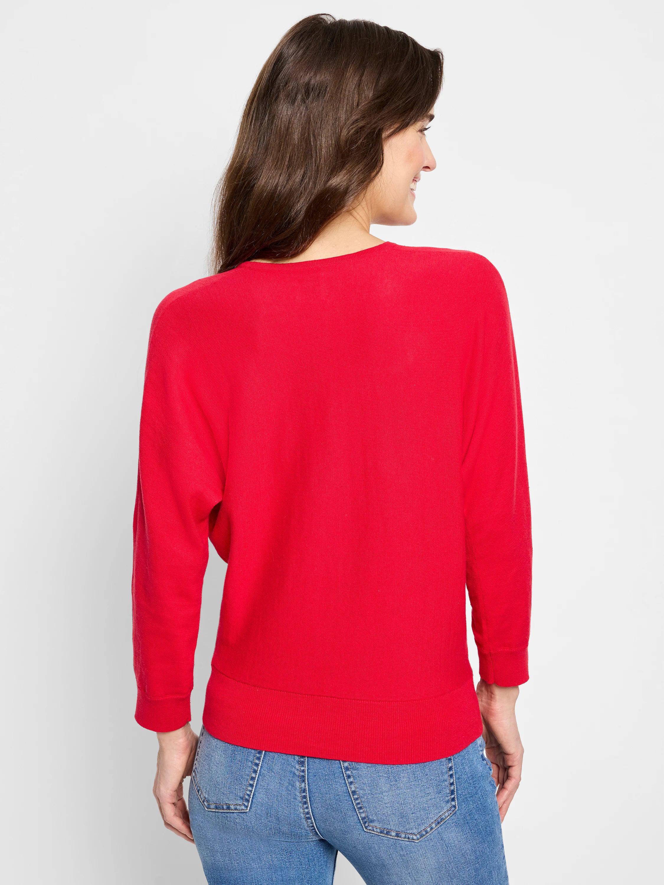 Red V-neck sweater (back view showing round neck), long sleeves, fine knit, ribbed cuffs/hem.