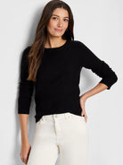 Black crew neck sweater with a subtle garter stitch texture, long sleeves, and ribbed cuffs.