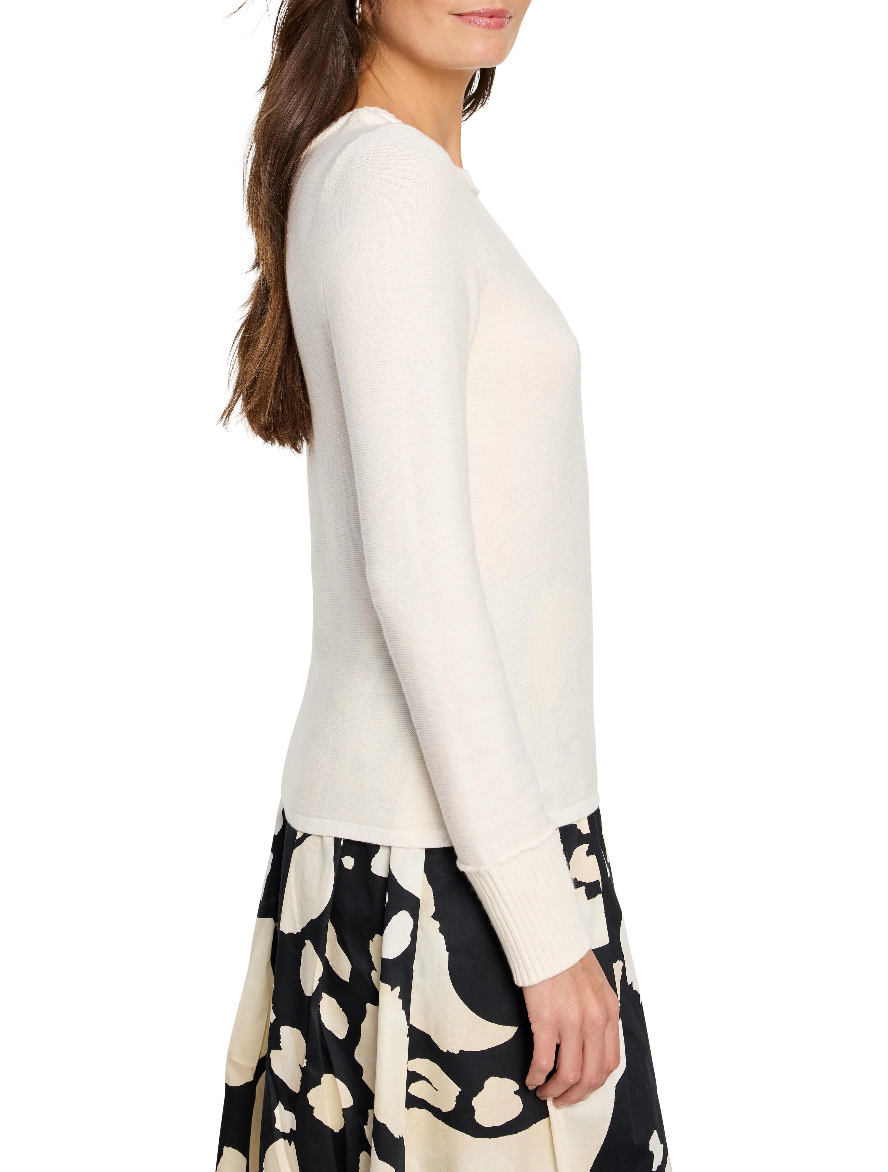 Cream baby garter knit crew neck sweater with ribbed cuffs, modeled.