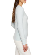 Pale blue crew neck sweater in a garter knit with ribbed cuffs.