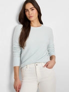 Baby blue garter knit crew neck sweater with ribbed cuffs and neckline.