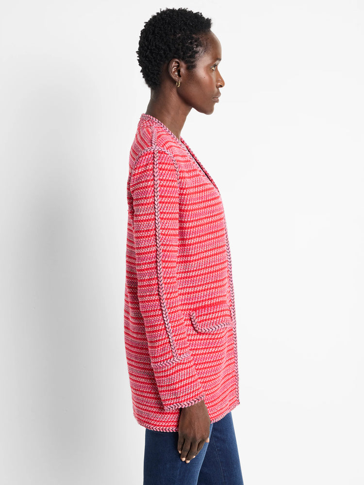 Pink and red striped cardigan with braided trim. Long sleeves, open front.